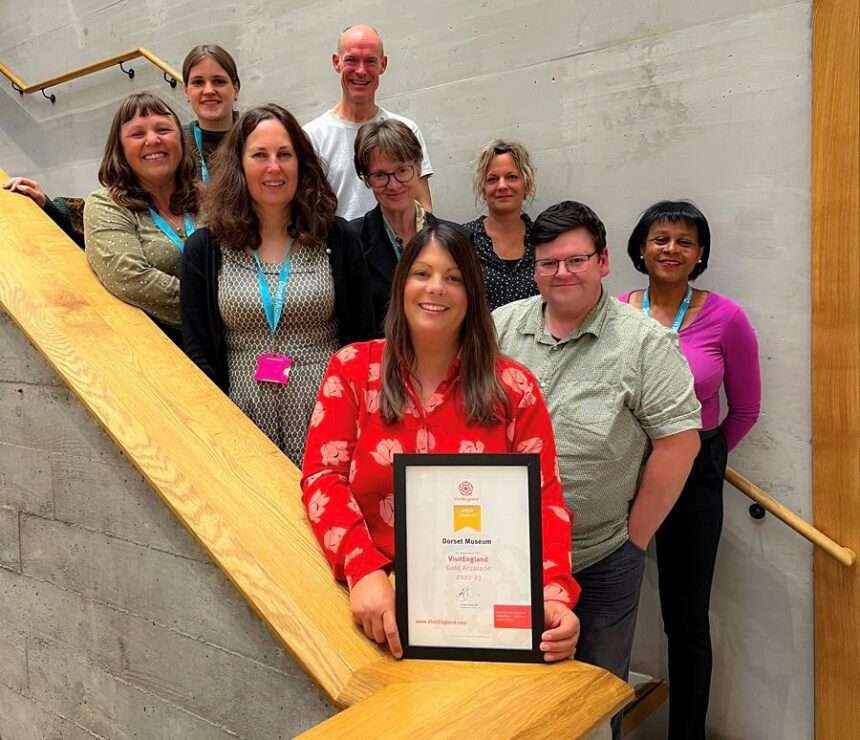 Claire Dixon, Executive Director and team of Dorset Museum & Art Gallery with the VisitEngland Gold Visitor Attraction Accolade - © Dorset Museum 2021